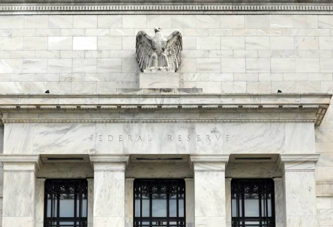 US Fed cuts interest rates, signals it is on hold