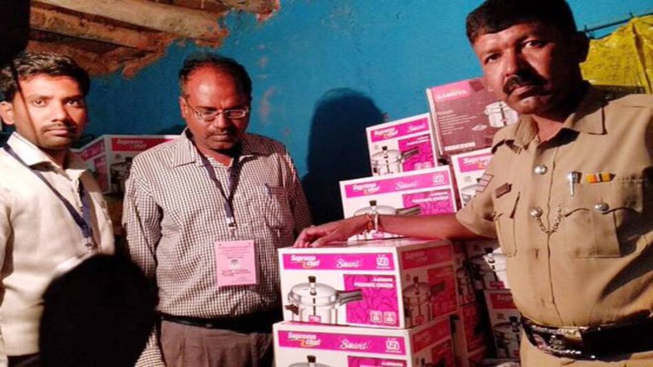 A flying squad of the Election Commission conducted raid and seized 53 pressure cookers from a house in poll bound Hoskote, Karnataka. (Photo: ANI) A flying squad of the Election Commission conducted raid and seized 53 pressure cookers from a house in poll bound Hoskote, Karnataka. (Photo: ANI)