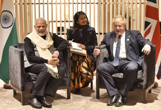 UK PM Johnson visits temple, vows to partner with PM Modi to build new India