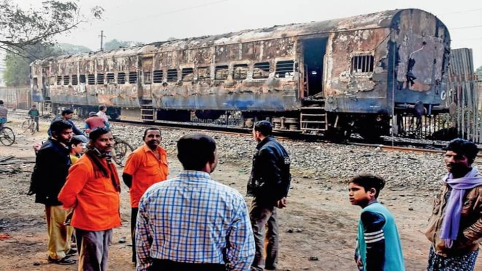 A train set on fire at Beldanga Station in Murshidabad district. Photo: India Today A train set on fire at Beldanga Station in Murshidabad district. Photo: India Today