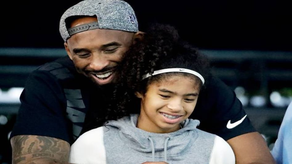 The late basketball player is survived by his wife Vanessa and three daughters The late basketball player is survived by his wife Vanessa and three daughters