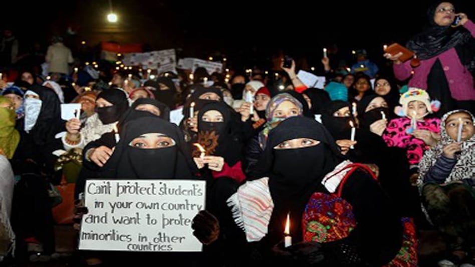 Women at candle march during protests against CAA, NRC and JNU violence at Delhi's Jama Masjid on 8 January (Wednesday). (Photo: PTI) Women at candle march during protests against CAA, NRC and JNU violence at Delhi's Jama Masjid on 8 January (Wednesday). (Photo: PTI)