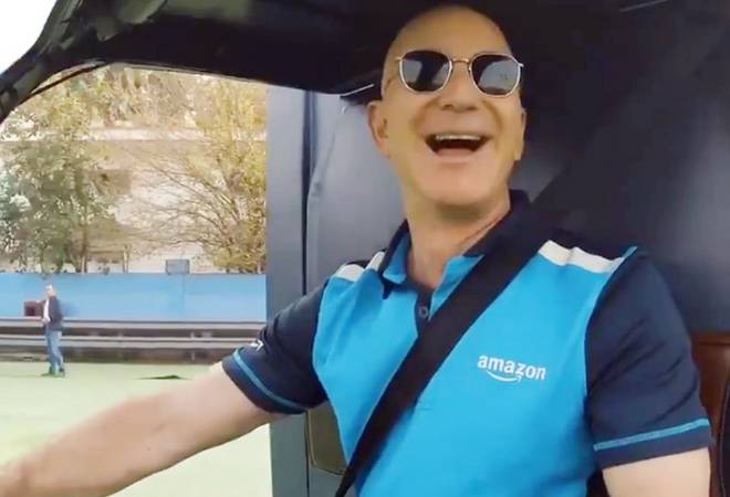Amazon chief Jeff Bezos riding on an electric delivery rickshaw Amazon chief Jeff Bezos riding on an electric delivery rickshaw