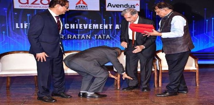 Infosys co-founder Narayana Murthy touches the feet of Ratan Tata at an event in Mumbai (Photo credit: IANS) Infosys co-founder Narayana Murthy touches the feet of Ratan Tata at an event in Mumbai (Photo credit: IANS)