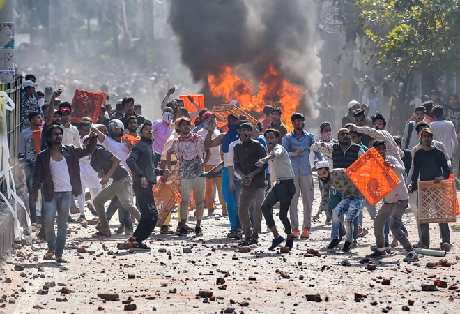 Delhi Violence: Rioters pelt stone at Jafrabad in Norteast Delhi (Photo credit: PTI) Delhi Violence: Rioters pelt stone at Jafrabad in Norteast Delhi (Photo credit: PTI)