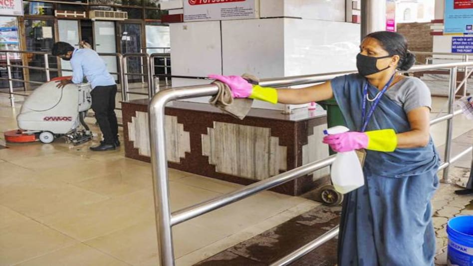 Volunteers sanitise a railing as a measure to prevent the spread of coronavirus, during nation-wide lockdown. Volunteers sanitise a railing as a measure to prevent the spread of coronavirus, during nation-wide lockdown.