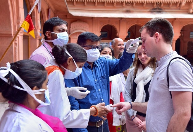 Tourists being scanned for coronavirus infection (Photo credit: PTI) Tourists being scanned for coronavirus infection (Photo credit: PTI)