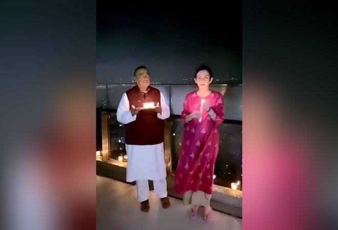 Mukesh Ambani and his wife Nita Ambani lit candles and earthen lamps at their residence Antilla. Tcouple switched off their lights at their palatial house as the clock struck 9 pm Mukesh Ambani and his wife Nita Ambani lit candles and earthen lamps at their residence Antilla. Tcouple switched off their lights at their palatial house as the clock struck 9 pm