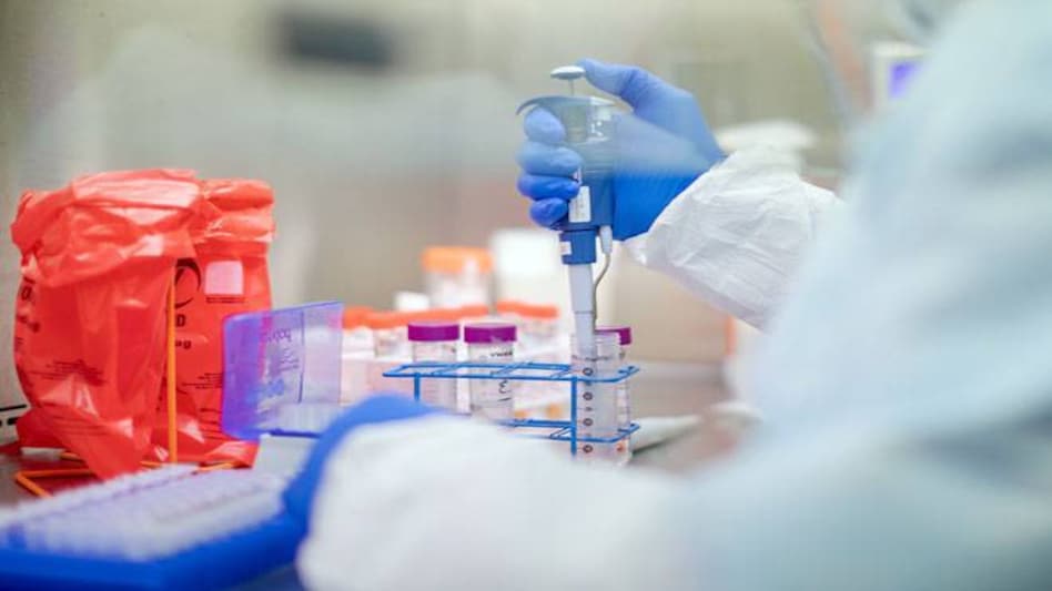 Initial tests focus on safety, and researchers in both countries are trying out different doses of different types of shots Initial tests focus on safety, and researchers in both countries are trying out different doses of different types of shots