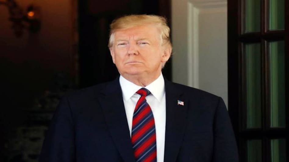 'I'm postponing it because I don't feel that as a G7 it properly represents what's going on in the world,' Trump said 'I'm postponing it because I don't feel that as a G7 it properly represents what's going on in the world,' Trump said