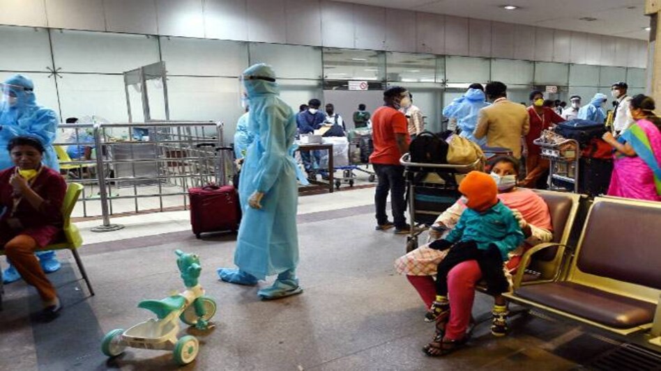 Medics wearing protective suits conduct a health check-up of Indian nationals who have arrived from Dubai by Air India flight at Anna International Airport Medics wearing protective suits conduct a health check-up of Indian nationals who have arrived from Dubai by Air India flight at Anna International Airport