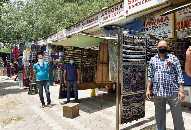 Lockdown 4.0 in Delhi: Shopkeepers wait for customers after opening their shops at Janpath market in CP, during the ongoing COVID-19 lockdown Lockdown 4.0 in Delhi: Shopkeepers wait for customers after opening their shops at Janpath market in CP, during the ongoing COVID-19 lockdown