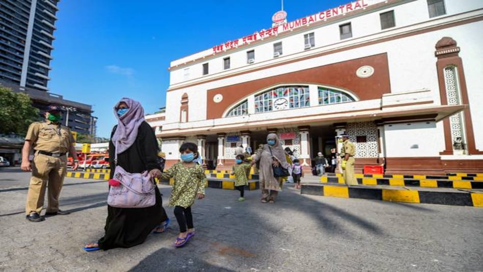 Passengers arrive from Delhi at Mumbai Central station following the resumption of passenger train services by Indian Railways Passengers arrive from Delhi at Mumbai Central station following the resumption of passenger train services by Indian Railways
