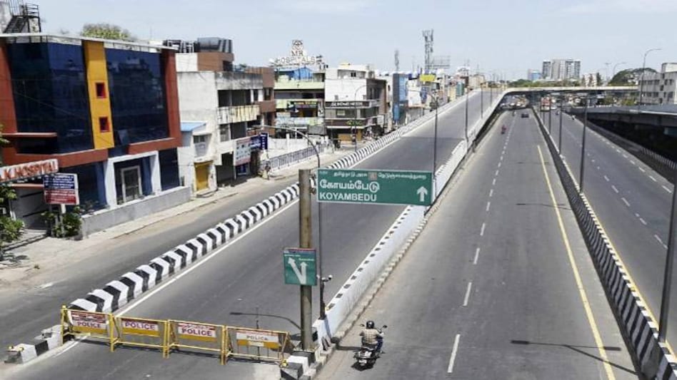 Vehicles ply on a deserted road during an intensified lockdown as a preventive measure against the spread of coronavirus disease Vehicles ply on a deserted road during an intensified lockdown as a preventive measure against the spread of coronavirus disease