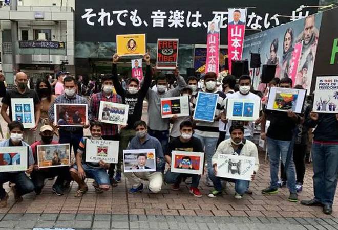 Protestors raising slogans against Chinese President Xi Jinping at Hachiko statue in Japan Protestors raising slogans against Chinese President Xi Jinping at Hachiko statue in Japan