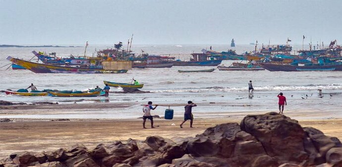 Fishing boats anchored at the shore following a warning by IMD for the fishermen to not enter the Arabian Sea for the next two days as a precaution against cyclone Nisarga in Thane. (Photo: PTI) Fishing boats anchored at the shore following a warning by IMD for the fishermen to not enter the Arabian Sea for the next two days as a precaution against cyclone Nisarga in Thane. (Photo: PTI)