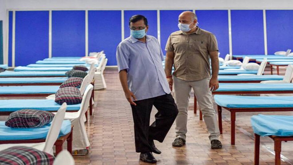Delhi Chief Minister Arvind Kejriwal and Deputy CM Manish Sisodia inspect a COVID centre set up at Commonwealth Games Village (CWG) indoor stadium, near Akshardham. Delhi Chief Minister Arvind Kejriwal and Deputy CM Manish Sisodia inspect a COVID centre set up at Commonwealth Games Village (CWG) indoor stadium, near Akshardham.