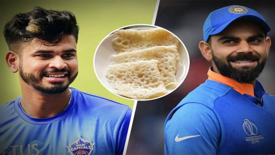 Virat Kohli receives neer dosa from Shreyas Iyer Virat Kohli receives neer dosa from Shreyas Iyer