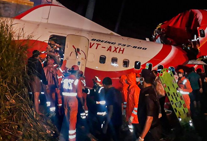 NDRF personnel evacuate passengers from wreckage of Air India Express flight IX-1344 at Karipur airport in Kozhikode (Photo credit: PTI) NDRF personnel evacuate passengers from wreckage of Air India Express flight IX-1344 at Karipur airport in Kozhikode (Photo credit: PTI)
