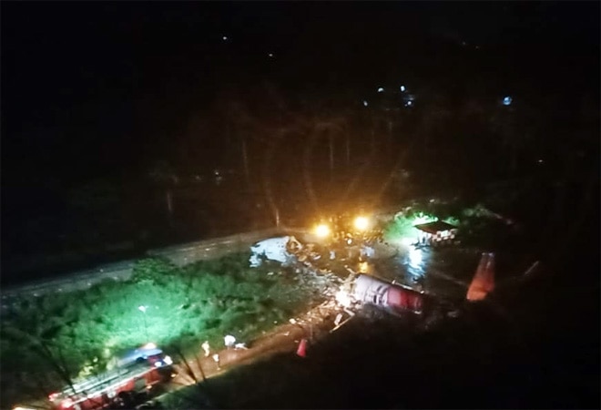 Air India Express flight IX-1344 skidded of the runway while landing at Kozhikode (Photo credit: ANI) Air India Express flight IX-1344 skidded of the runway while landing at Kozhikode (Photo credit: ANI)