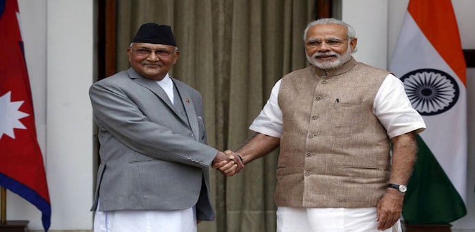Nepal's Prime Minister Khadga Prasad Sharma Oli (L) shakes hands with his Indian counterpart Narendra Modi Nepal's Prime Minister Khadga Prasad Sharma Oli (L) shakes hands with his Indian counterpart Narendra Modi