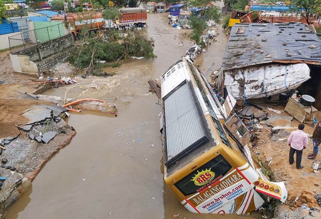 Hyderabad rains: Car floats, man swims on road; watch videos