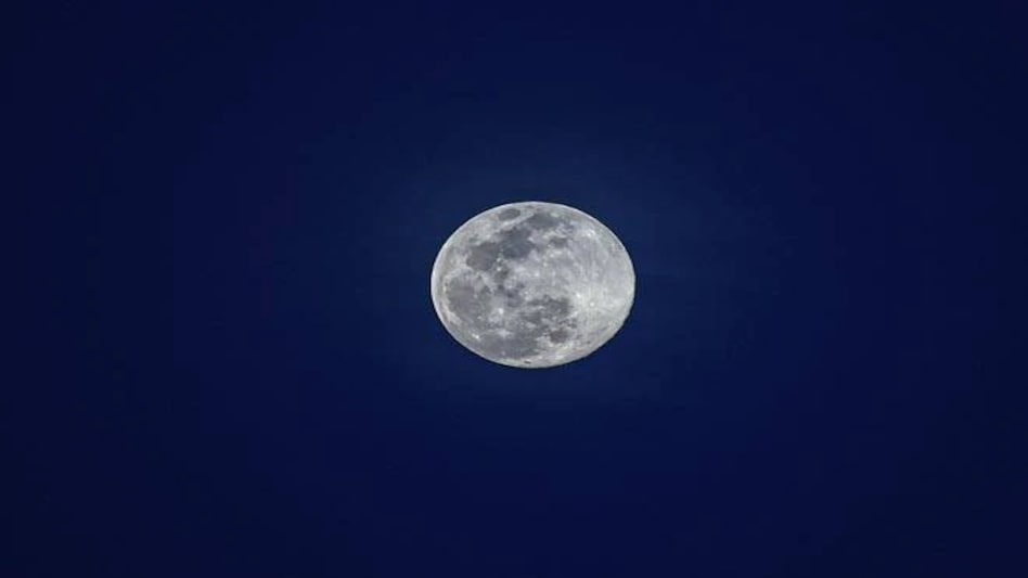 NASA said that events such as forest fires and dust storms can give the moon a bluish tint NASA said that events such as forest fires and dust storms can give the moon a bluish tint