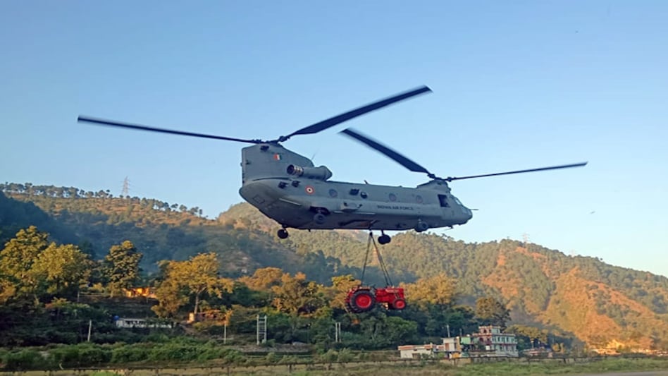 Mahindra Tractors' official Twitter account had shared two photos of an IAF chopper carrying the company's tractor Mahindra Tractors' official Twitter account had shared two photos of an IAF chopper carrying the company's tractor