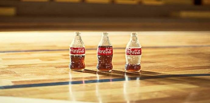 The Atlanta-based company said around half of the layoffs will occur in the US, where Coke employs around 10,400 people The Atlanta-based company said around half of the layoffs will occur in the US, where Coke employs around 10,400 people