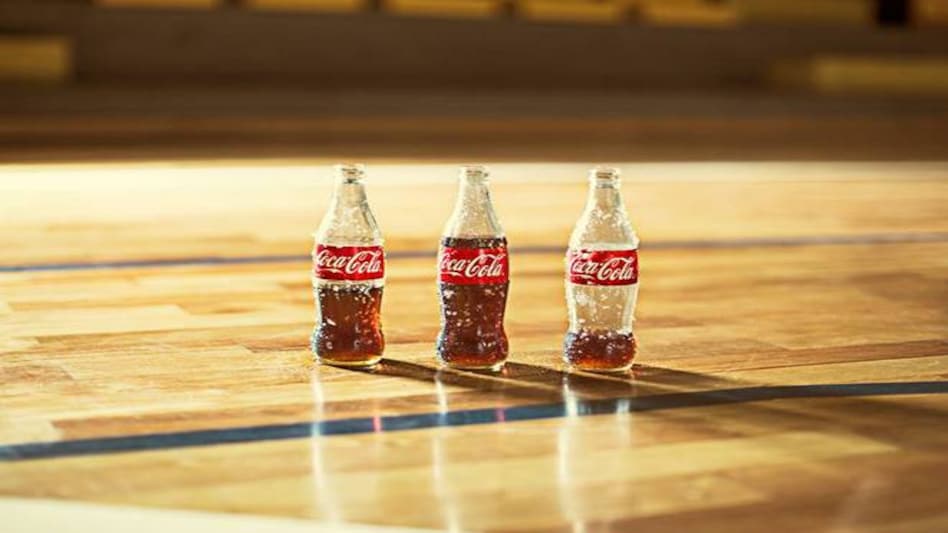 The Atlanta-based company said around half of the layoffs will occur in the US, where Coke employs around 10,400 people The Atlanta-based company said around half of the layoffs will occur in the US, where Coke employs around 10,400 people