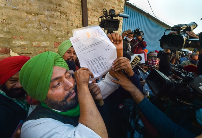A farmer representative shows the draft proposal Centre sent to 13 protesting farmer unions A farmer representative shows the draft proposal Centre sent to 13 protesting farmer unions