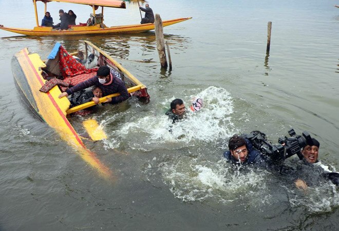 The shikara capsized when it was closing on the bank of the lake in the last leg of the rally The shikara capsized when it was closing on the bank of the lake in the last leg of the rally