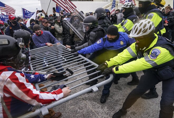 US Capitol violence: The demonstrations flared as lawmakers met inside to formally certify Biden's victory over Trump in the Nov. 3 election US Capitol violence: The demonstrations flared as lawmakers met inside to formally certify Biden's victory over Trump in the Nov. 3 election
