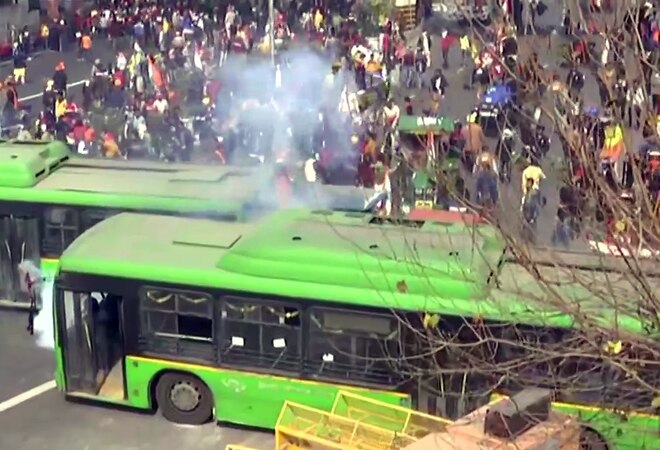 Police use tear gas shells to disperse the protesting farmers at ITO in central Delhi. Police use tear gas shells to disperse the protesting farmers at ITO in central Delhi.