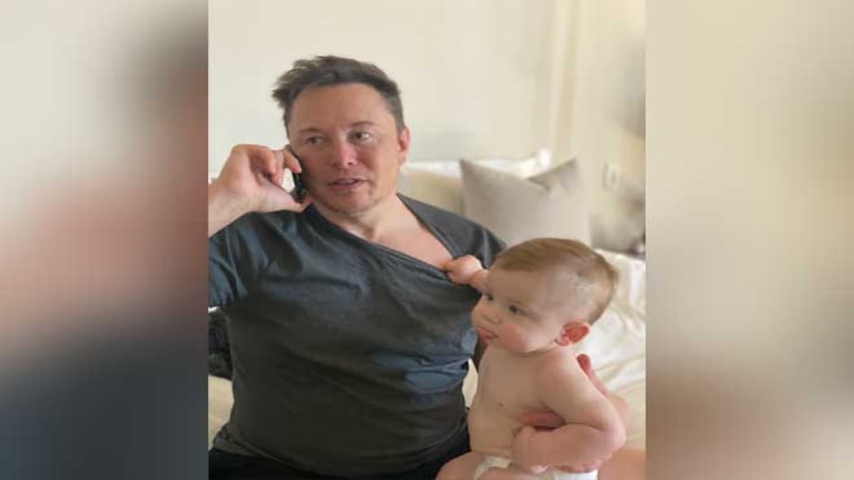 Tesla CEO Elon Musk and his son X AE A-XII Tesla CEO Elon Musk and his son X AE A-XII