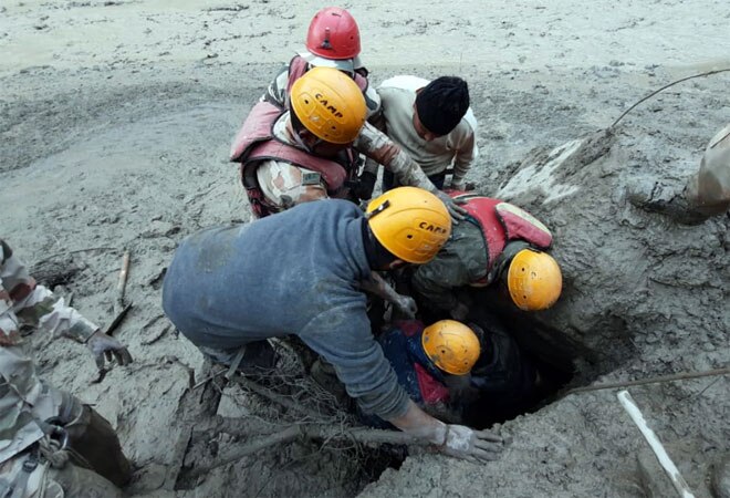 ITBP personnel rescue labourers from the sediment inundated area near the Tapovan tunnel area ITBP personnel rescue labourers from the sediment inundated area near the Tapovan tunnel area