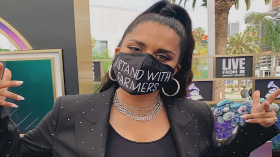 Singh is wore a black power suit with the 'I Stand With Framers' mask Singh is wore a black power suit with the 'I Stand With Framers' mask