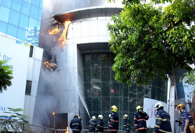Firefighters attempt to douse a blaze at Dreams Mall, affecting patients admitted in the nearby COVID-19 dedicated Sunrise Hospital, in Mumbai. Firefighters attempt to douse a blaze at Dreams Mall, affecting patients admitted in the nearby COVID-19 dedicated Sunrise Hospital, in Mumbai.