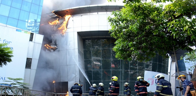 Firefighters attempt to douse a blaze at Dreams Mall, affecting patients admitted in the nearby COVID-19 dedicated Sunrise Hospital, in Mumbai. Firefighters attempt to douse a blaze at Dreams Mall, affecting patients admitted in the nearby COVID-19 dedicated Sunrise Hospital, in Mumbai.