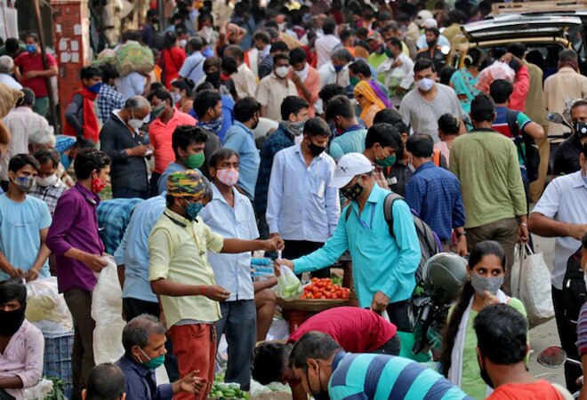 People shop at a crowded marketplace amidst the spread of the coronavirus disease in Mumbai, April 21. (Photo:Reuters) People shop at a crowded marketplace amidst the spread of the coronavirus disease in Mumbai, April 21. (Photo:Reuters)