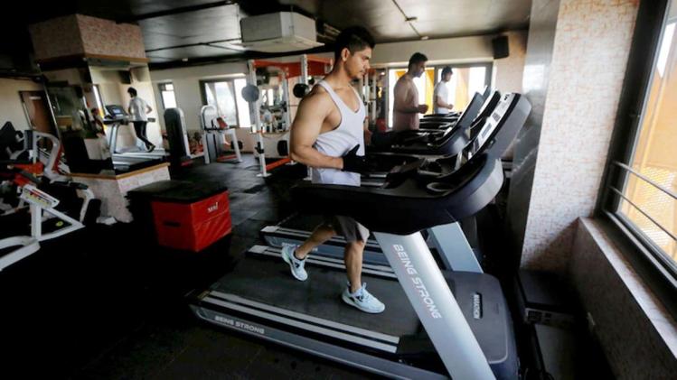 Gyms and yoga institutes are now allowed to operate with 50% capacity in Delhi. (Photo: PTI) Gyms and yoga institutes are now allowed to operate with 50% capacity in Delhi. (Photo: PTI)