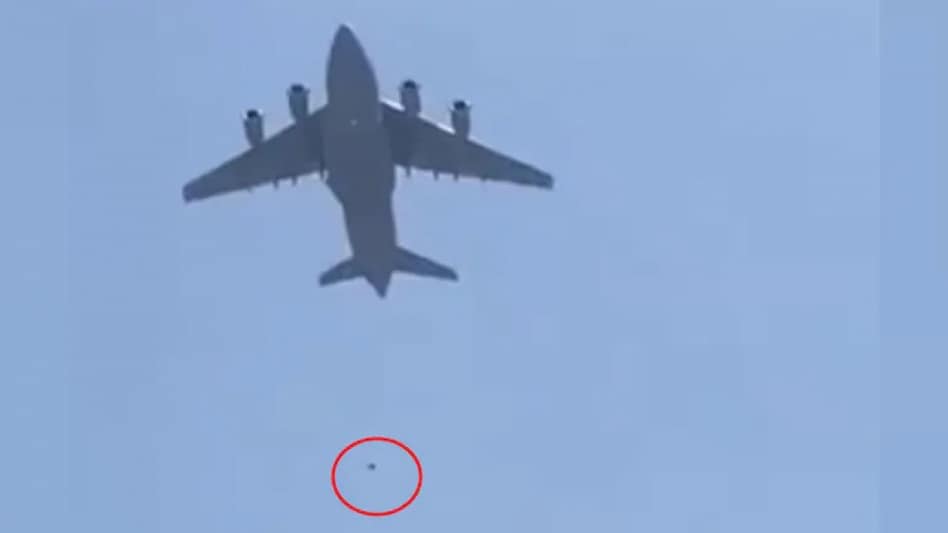 The two persons tied themselves to wheels of aircraft and fell. (Screengrab) The two persons tied themselves to wheels of aircraft and fell. (Screengrab)