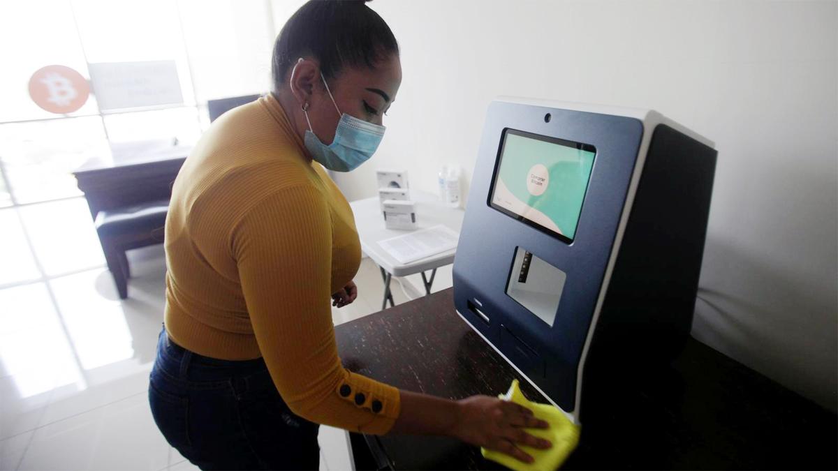 Claudia Suazo cleans a cryptocurrency ATM machine, the first in the country, that allows users to acquire bitcoin and ethereum using the local lempira currency, at the office of Honduran firm TGU Consulting Group, in Tegucigalpa, Honduras August Claudia Suazo cleans a cryptocurrency ATM machine, the first in the country, that allows users to acquire bitcoin and ethereum using the local lempira currency, at the office of Honduran firm TGU Consulting Group, in Tegucigalpa, Honduras August