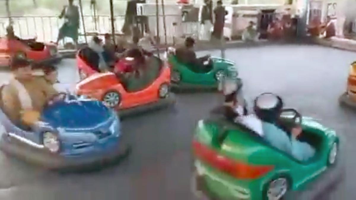 Taliban soldiers riding bumper cars at a theme park Taliban soldiers riding bumper cars at a theme park