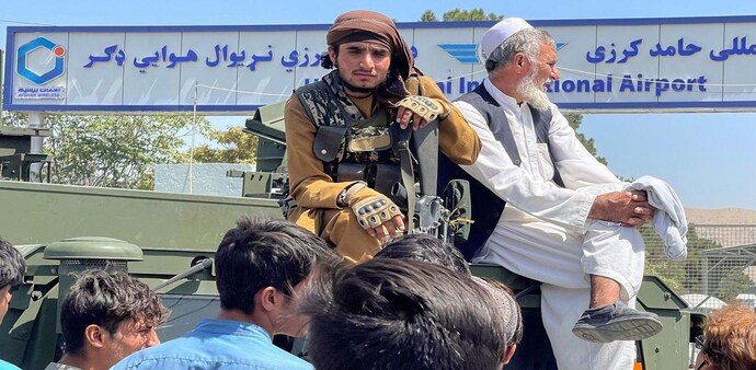 On Tuesday, Kabul's international airport reopened to military evacuation flights under the watch of American troops (Source:Reuters) On Tuesday, Kabul's international airport reopened to military evacuation flights under the watch of American troops (Source:Reuters)