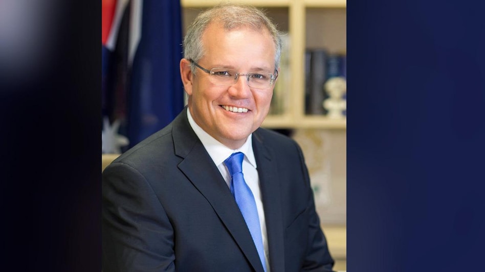 In interviews with Australian media after a summit in Washington, Morrison said his government was still working on its emissions plans, declining to commit to curbing fossil fuels that account for a major part of Australia's export revenue. In interviews with Australian media after a summit in Washington, Morrison said his government was still working on its emissions plans, declining to commit to curbing fossil fuels that account for a major part of Australia's export revenue.