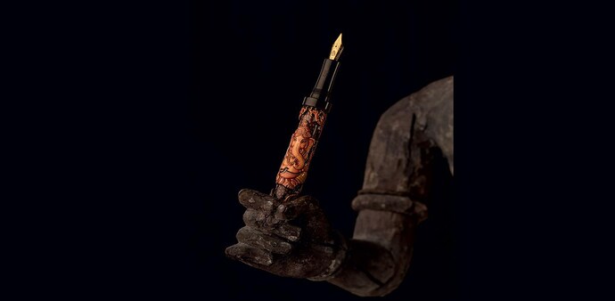 A lotus pen photographed on an 18th century crafted wood sculpture. Location courtesy of beyond designs A lotus pen photographed on an 18th century crafted wood sculpture. Location courtesy of beyond designs