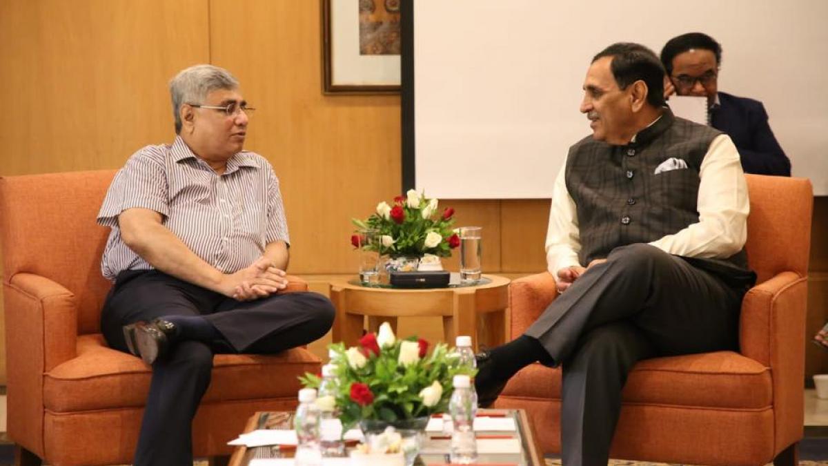 Swan Energy MD Nikhil Merchant (left) with former Gujarat CM Vijay Rupani. Photo: Twitter Swan Energy MD Nikhil Merchant (left) with former Gujarat CM Vijay Rupani. Photo: Twitter