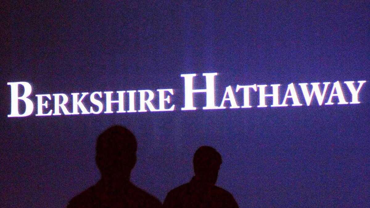 Berkshire Hathaway's operating profit surges, cash hoard sets record
