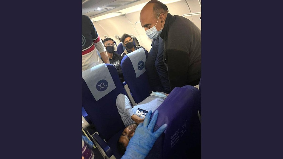 Minister of State for Finance Dr Bhagwat Karad providing medical assistance to a passenger onboard a Delhi-Mumbai IndiGo flight Minister of State for Finance Dr Bhagwat Karad providing medical assistance to a passenger onboard a Delhi-Mumbai IndiGo flight